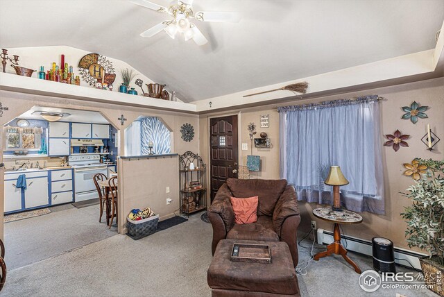 carpeted living room featuring ceiling fan, sink, and vaulted ceiling