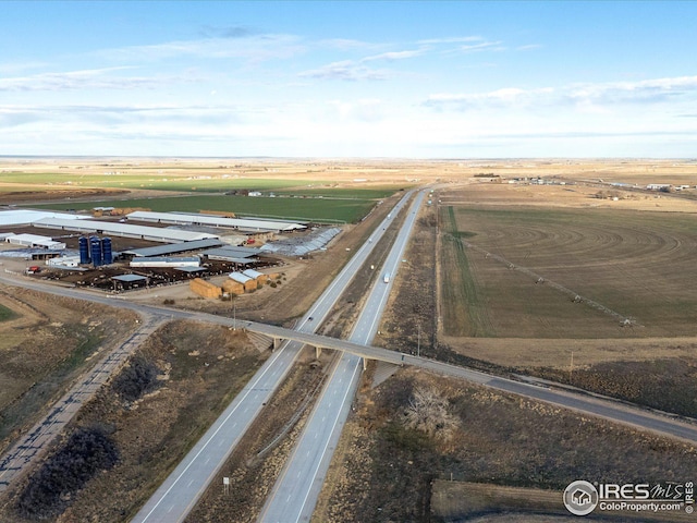 birds eye view of property with a rural view