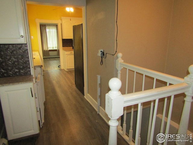 hallway featuring dark hardwood / wood-style floors