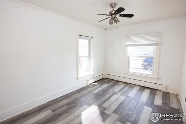 empty room with hardwood / wood-style flooring, a baseboard radiator, ornamental molding, and ceiling fan