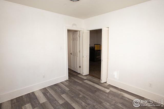 empty room featuring dark wood-type flooring