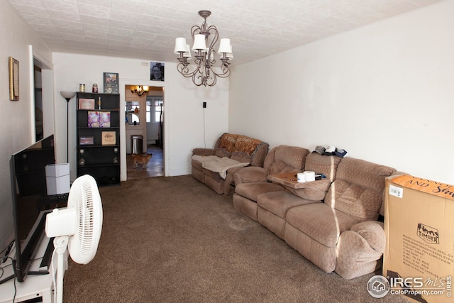 living room featuring carpet and a chandelier