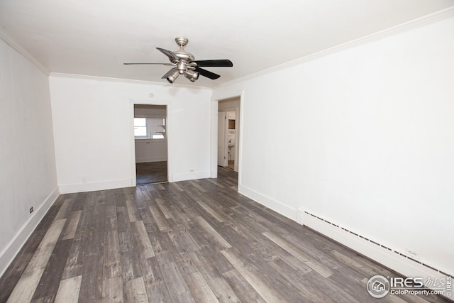 spare room with dark wood-type flooring, ceiling fan, ornamental molding, and a baseboard heating unit