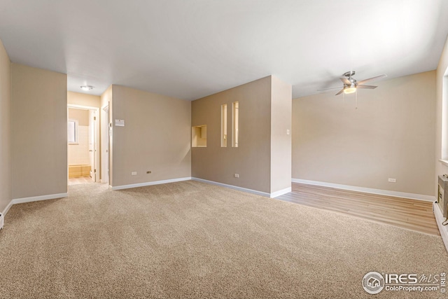 unfurnished room featuring light wood-type flooring and ceiling fan