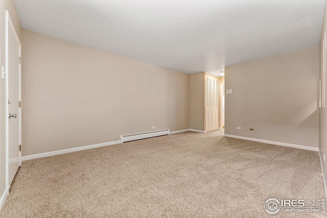 unfurnished room with light colored carpet and a baseboard radiator