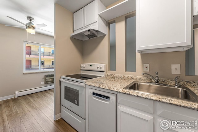 kitchen with sink, baseboard heating, light hardwood / wood-style flooring, white appliances, and white cabinets