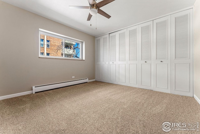 unfurnished bedroom with ceiling fan, carpet, and a baseboard radiator