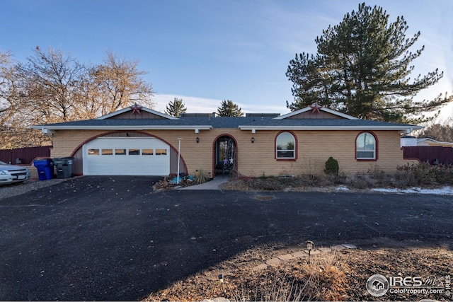 ranch-style home with a garage