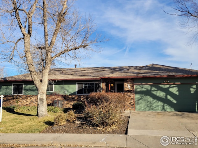 single story home featuring a garage