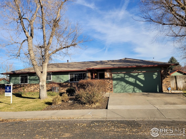 single story home featuring a garage