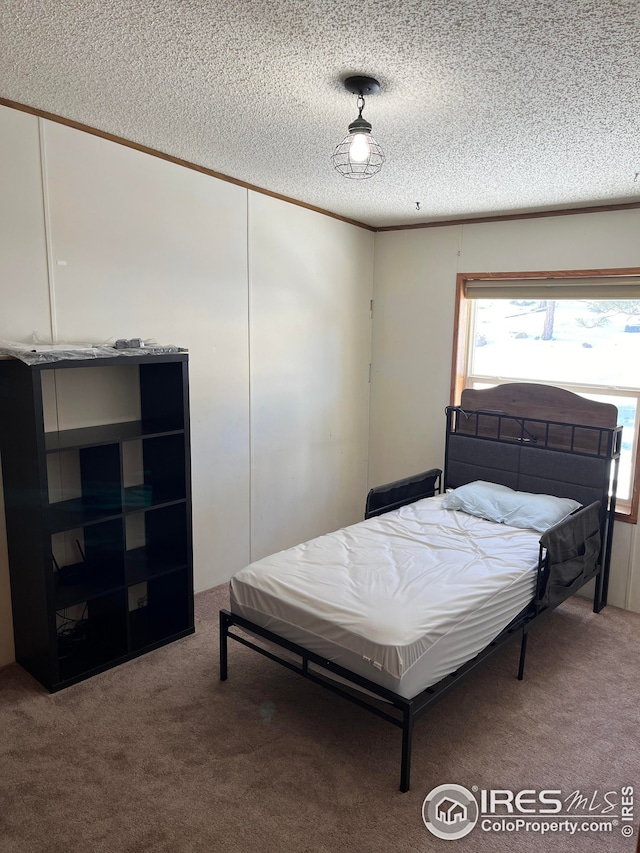 carpeted bedroom with a textured ceiling