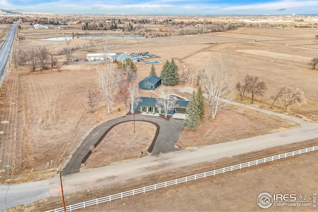 birds eye view of property with a rural view