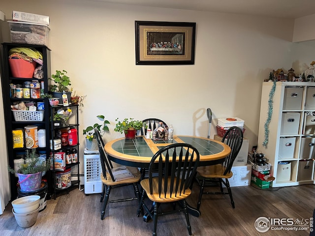 dining area with wood-type flooring