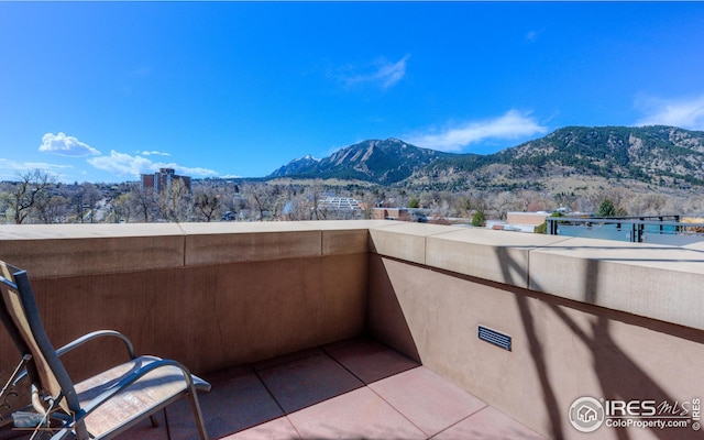 balcony featuring a mountain view