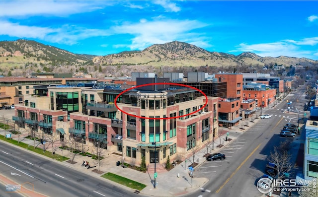 birds eye view of property with a mountain view