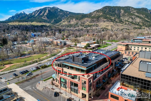 birds eye view of property featuring a mountain view