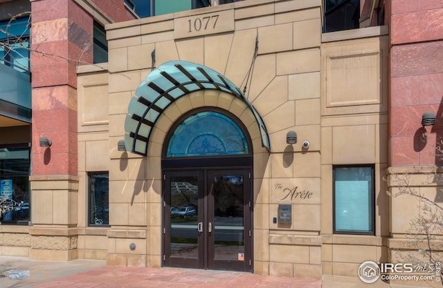 view of exterior entry featuring french doors