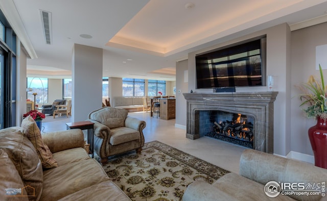 living room featuring a tray ceiling