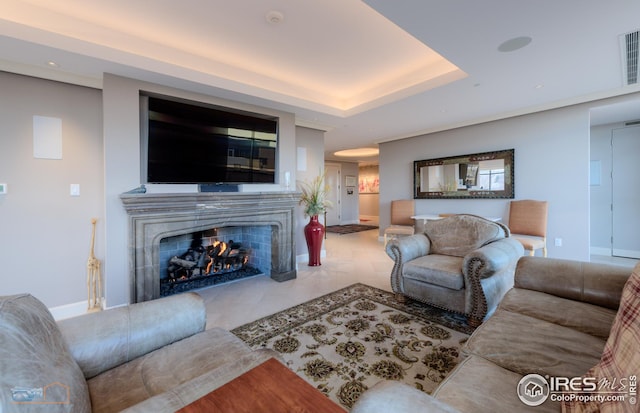 living room featuring a tray ceiling