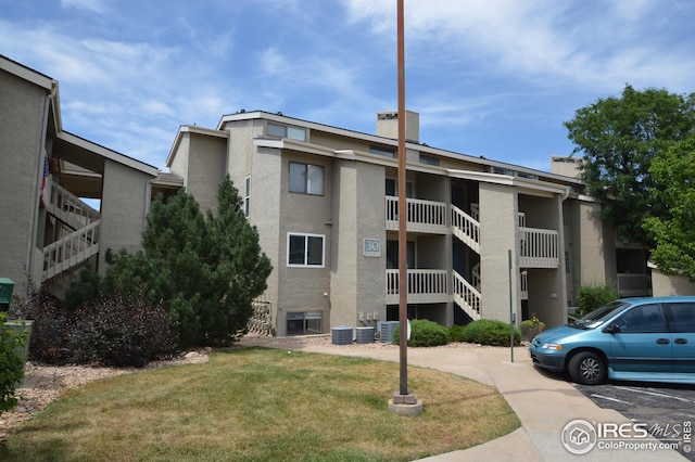 view of building exterior with cooling unit