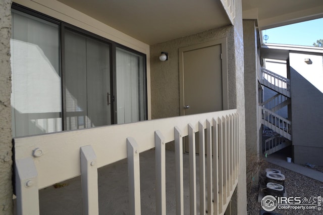 entrance to property with stucco siding