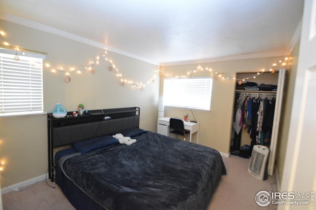 bedroom featuring baseboards, ornamental molding, a closet, and light colored carpet