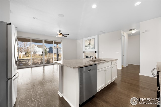 1604 Sorenson Dr, Windsor, CO 80550 - kitchen featuring dark wood finished floors, ceiling fan, stainless steel appliances, and a sink