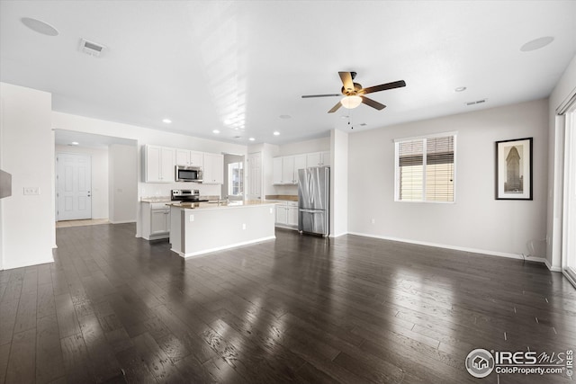 1604 Sorenson Dr, Windsor, CO 80550 - unfurnished living room featuring dark wood finished floors, a ceiling fan, visible vents, and recessed lighting