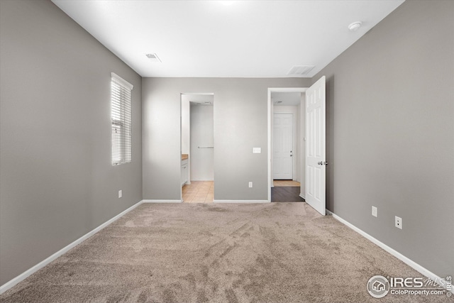 1604 Sorenson Dr, Windsor, CO 80550 - unfurnished bedroom featuring light carpet, visible vents, and baseboards
