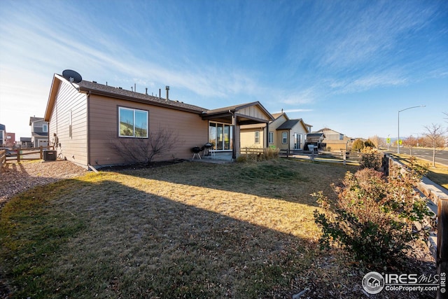 1604 Sorenson Dr, Windsor, CO 80550 - rear view of house featuring central air condition unit, a patio, and fence
