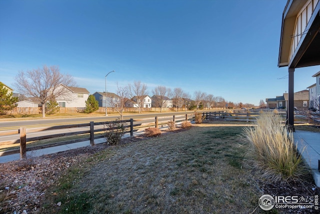 1604 Sorenson Dr, Windsor, CO 80550 - view of yard featuring fence and a residential view