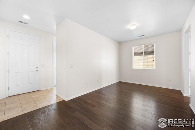 1604 Sorenson Dr, Windsor, CO 80550 - unfurnished room featuring wood-type flooring, baseboards, and visible vents