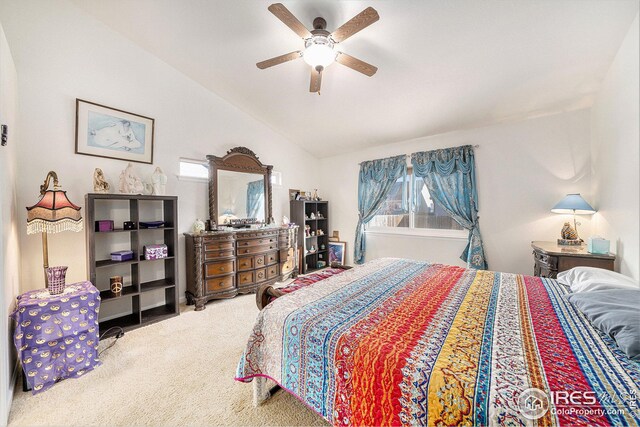 carpeted bedroom with ceiling fan and lofted ceiling