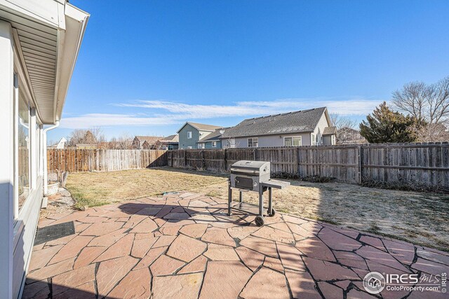 view of patio with a grill