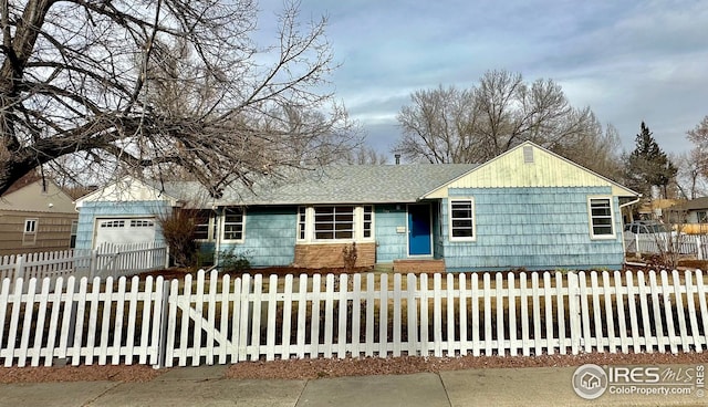 view of front of property with a garage