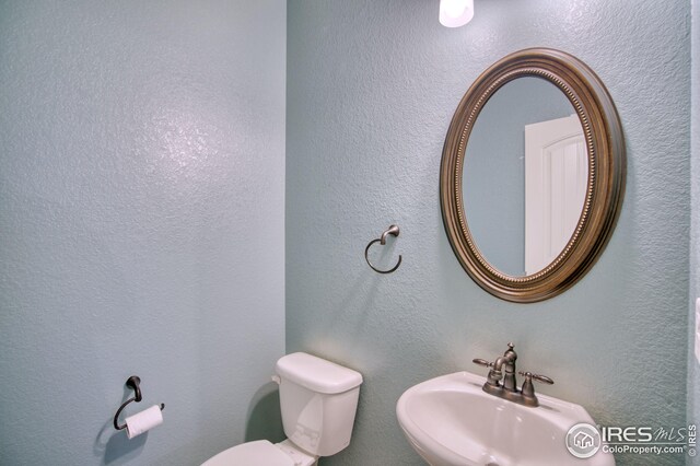 bathroom with sink and toilet