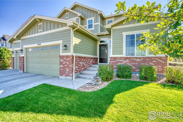 craftsman-style home featuring a front yard and a garage