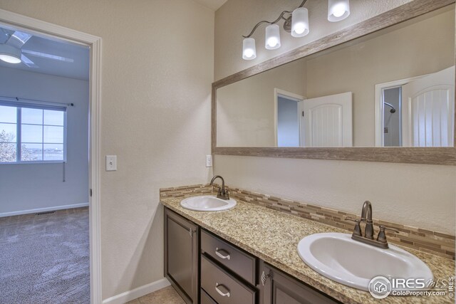 bathroom with vanity and ceiling fan