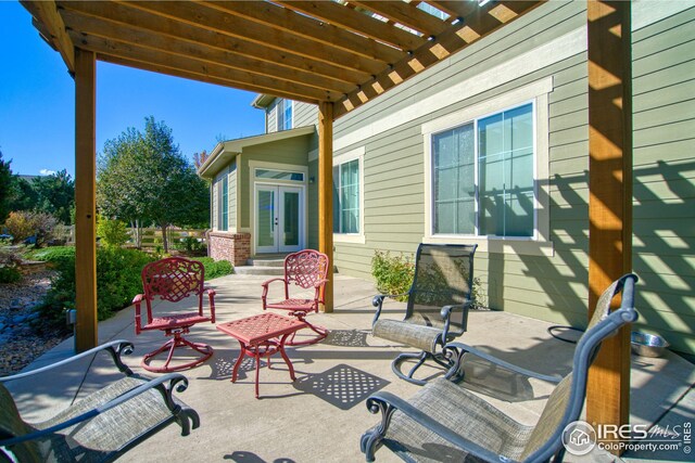 view of patio with a pergola and french doors