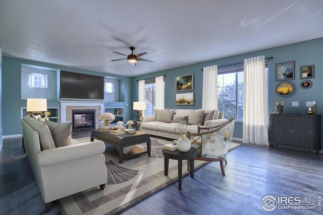 living room with ceiling fan and dark wood-type flooring