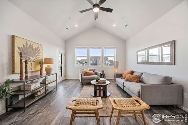 living room with dark wood-style floors, high vaulted ceiling, visible vents, and baseboards