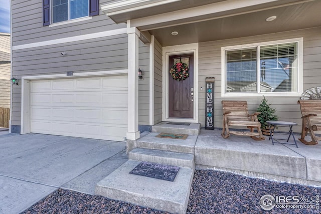 entrance to property with a garage and driveway