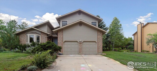 front facade featuring a garage and a front lawn