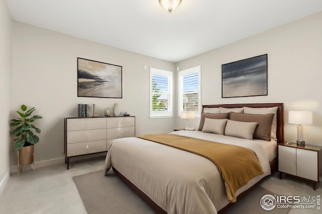 bedroom featuring baseboards
