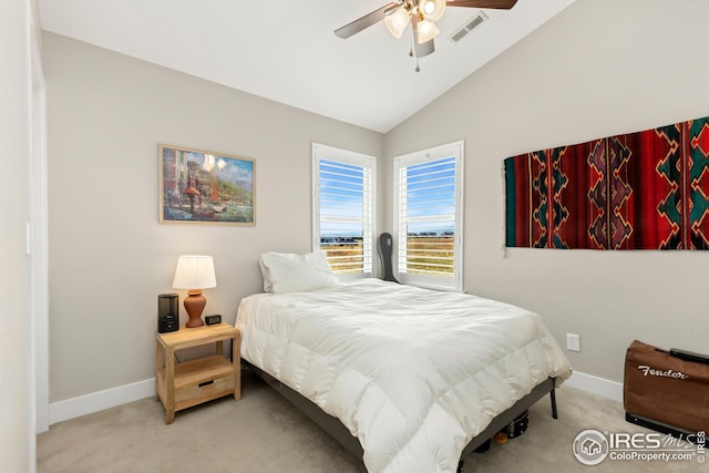carpeted bedroom featuring baseboards, visible vents, a ceiling fan, and vaulted ceiling