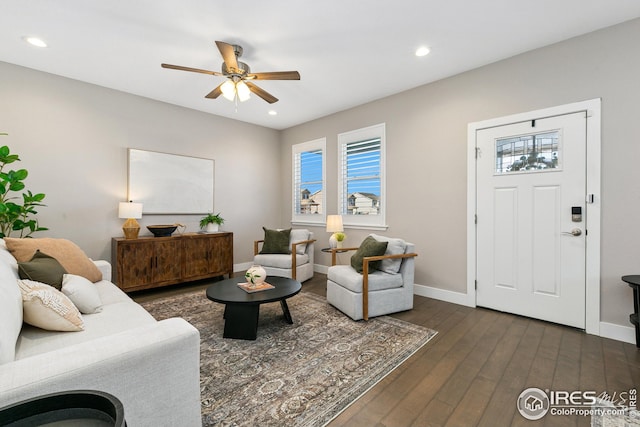 living room featuring recessed lighting, ceiling fan, dark wood-style flooring, and baseboards
