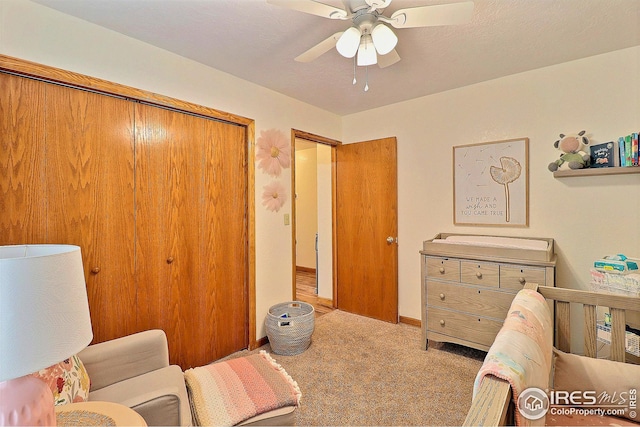 carpeted bedroom with ceiling fan