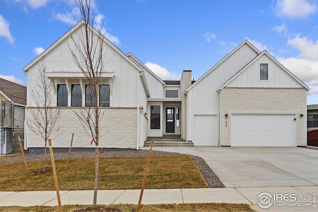 view of front of house featuring a garage, a front yard, and central AC