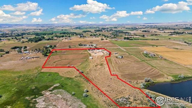 aerial view featuring a rural view and a water view