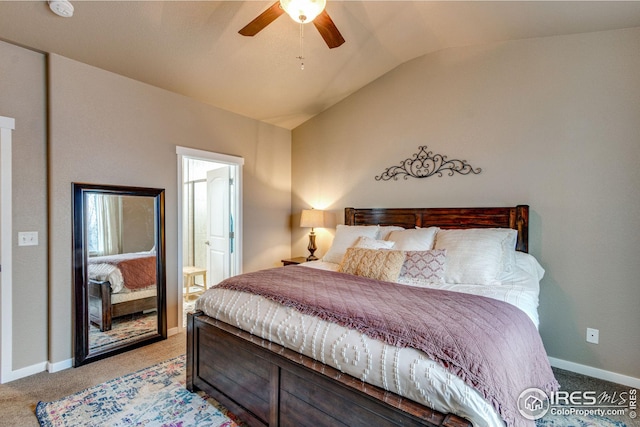 carpeted bedroom featuring ceiling fan, ensuite bathroom, and vaulted ceiling